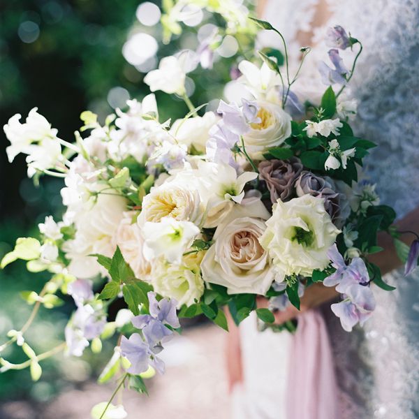 White and Purple Wedding Bouquet With Spring Flowers