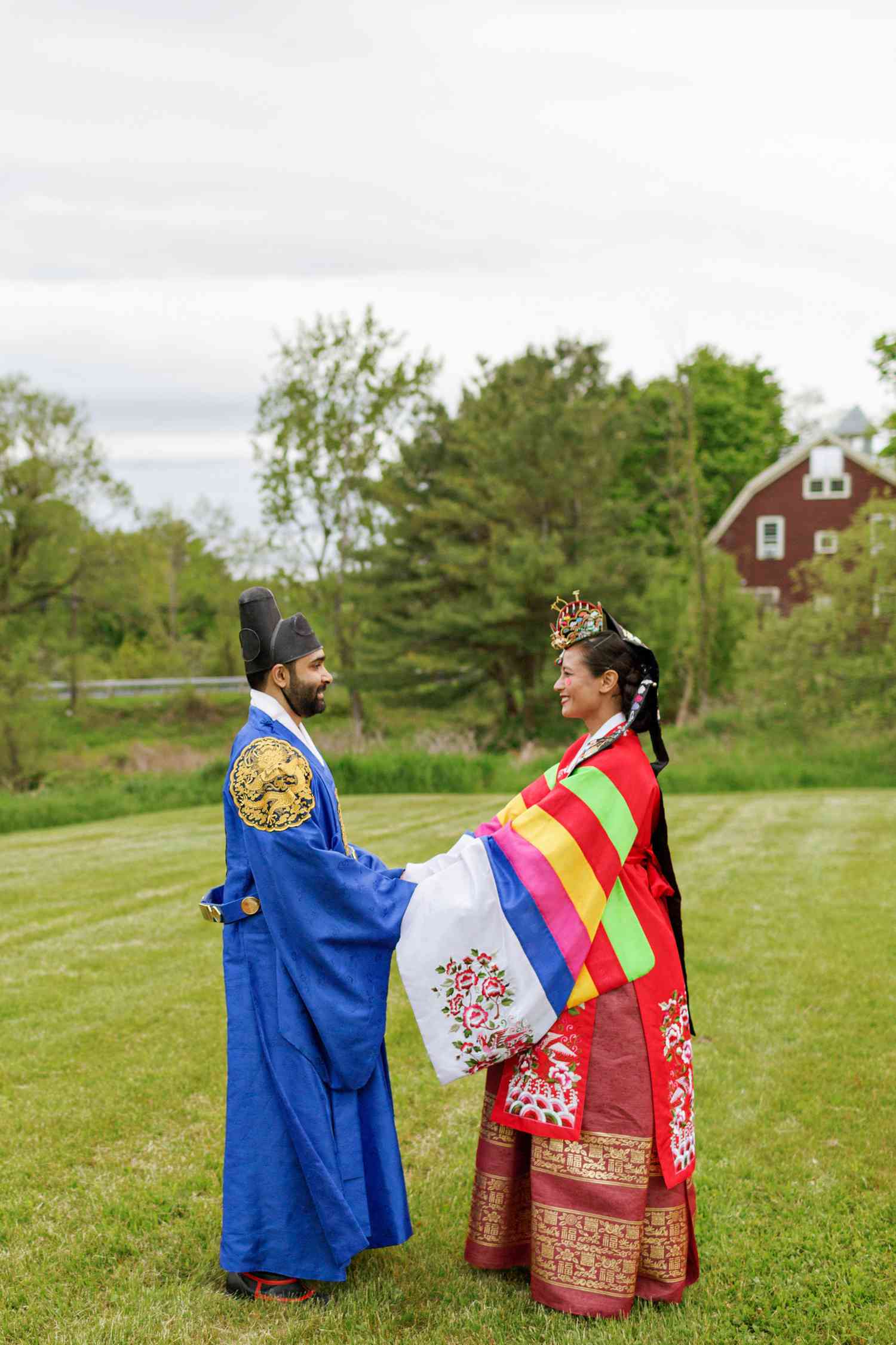 Couple in hanbok during a traditional South Korean wedding.