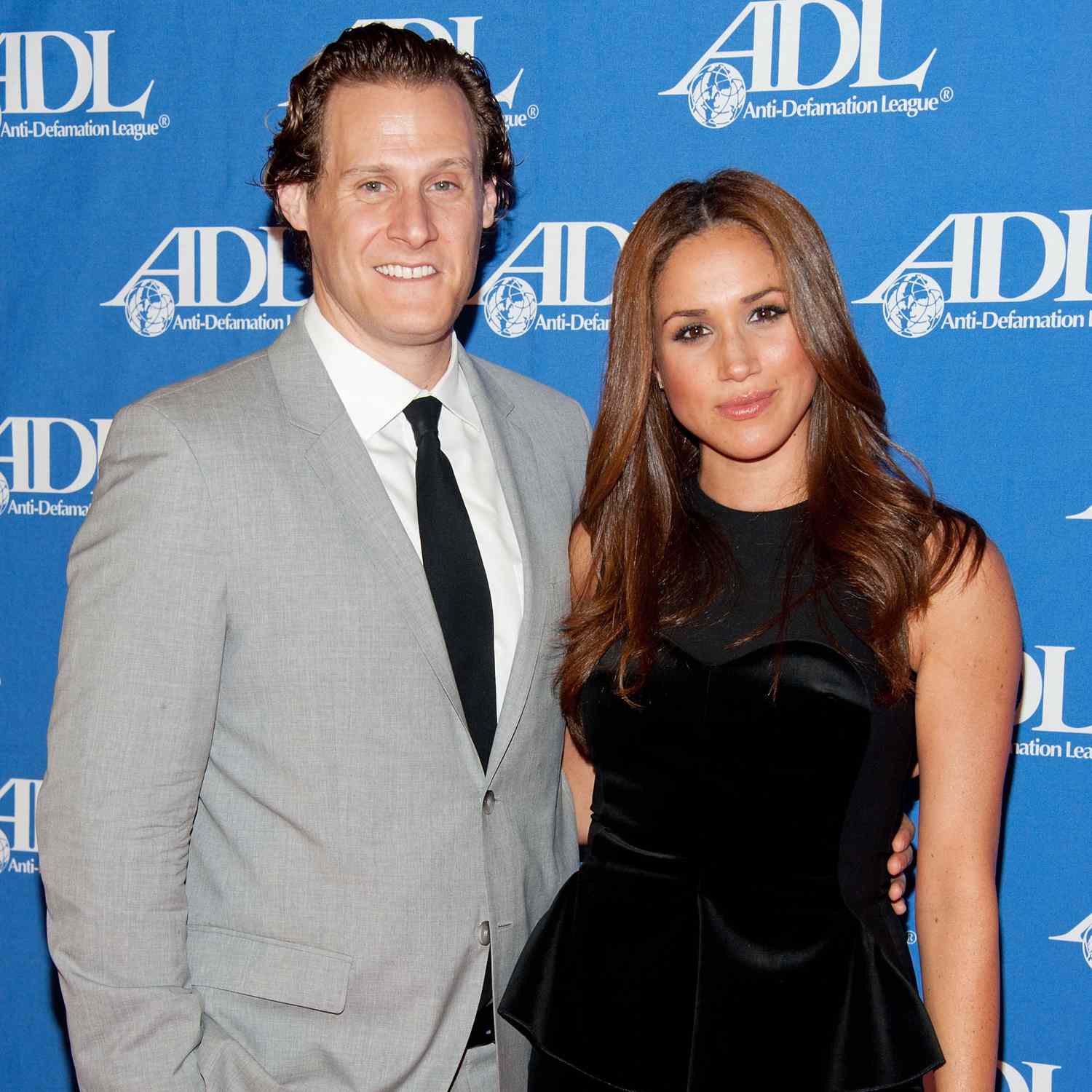 Meghan Markle in Black Dress and Ex-Husband Trevor Engelson in Gray Suit on Red Carpet