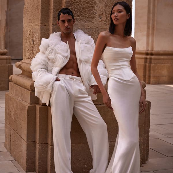 Milla Nova Fall 2024 BFW Collection models wearing white dress and white pants with floral jacket