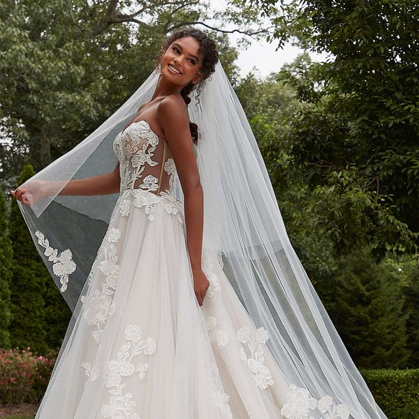 Morilee Madeline Gardner BFW model wearing a strapless wedding dress with lace and tulle