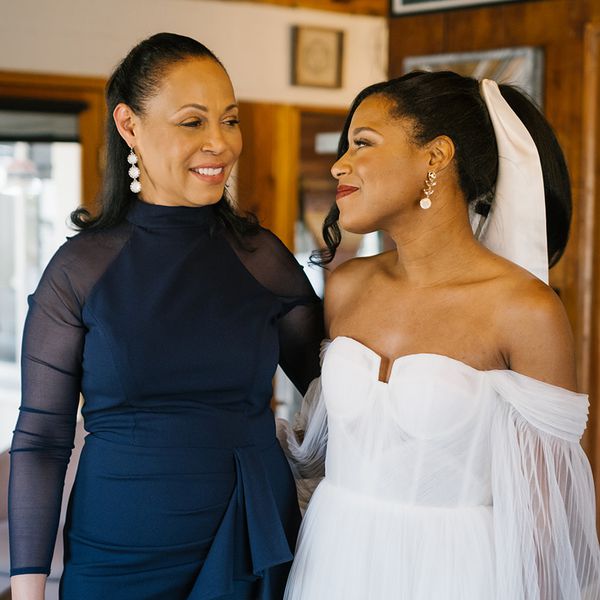Mother of the Bride in Slicked-Back Down-Style Looking at Bride