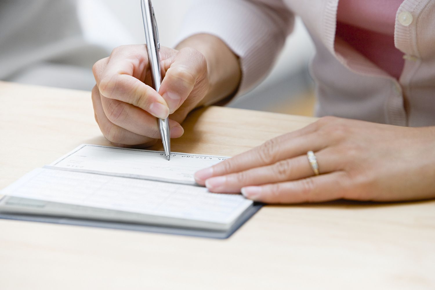 Woman writing a check
