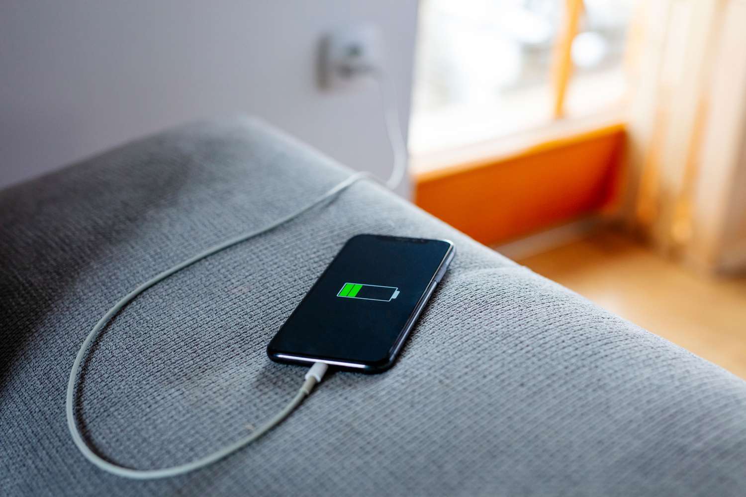 Phone charging on couch