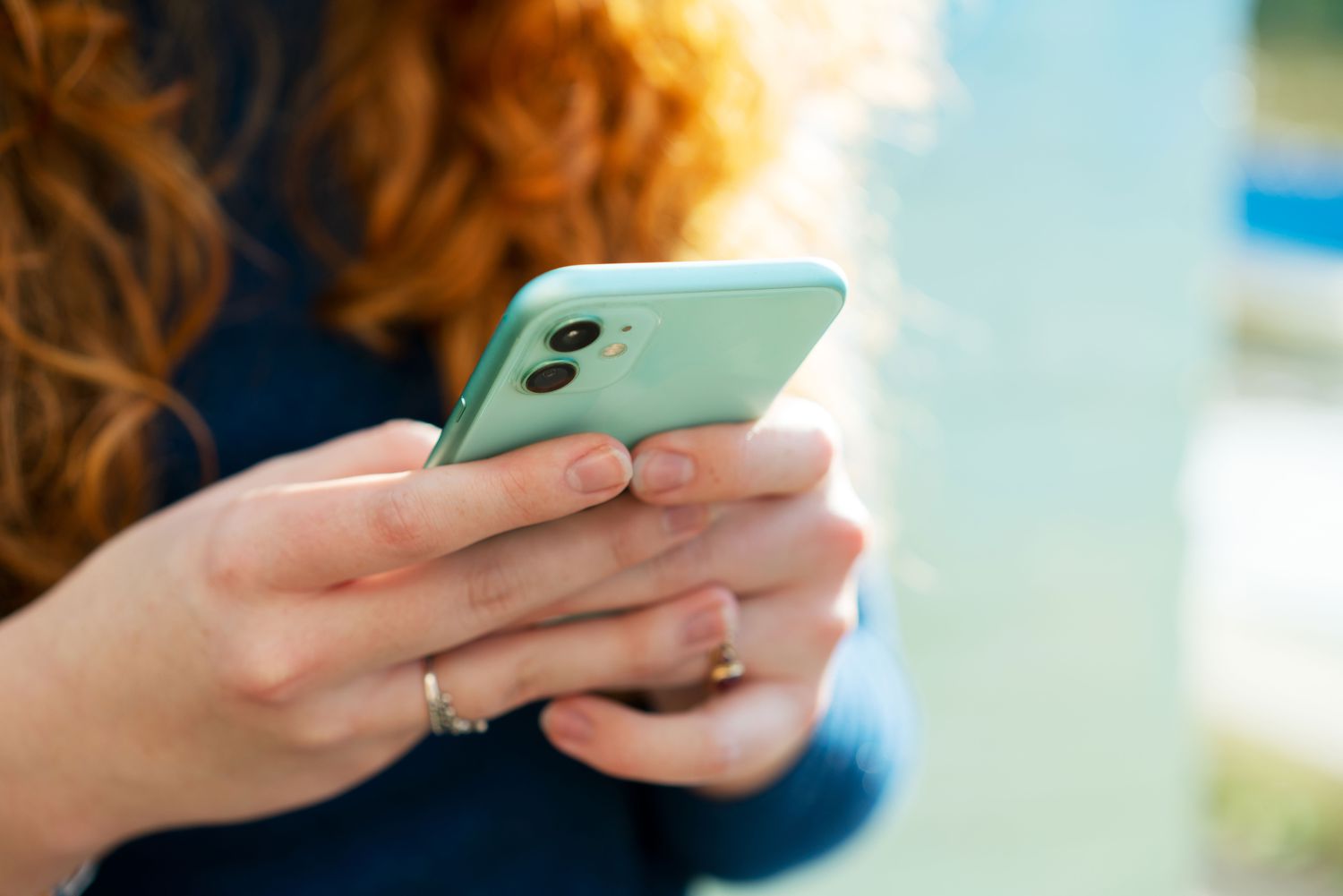 Woman texting on iPhone