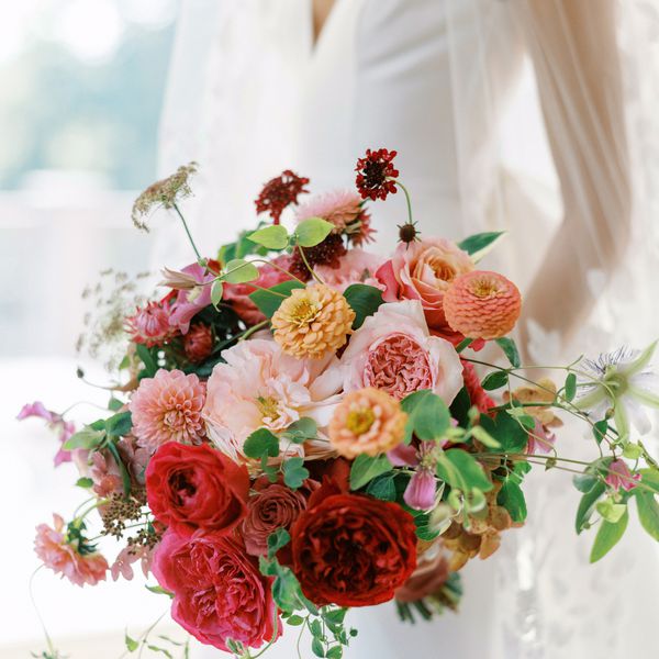 pink and burgundy wedding bouquet with garden roses, zinnias, and greenery