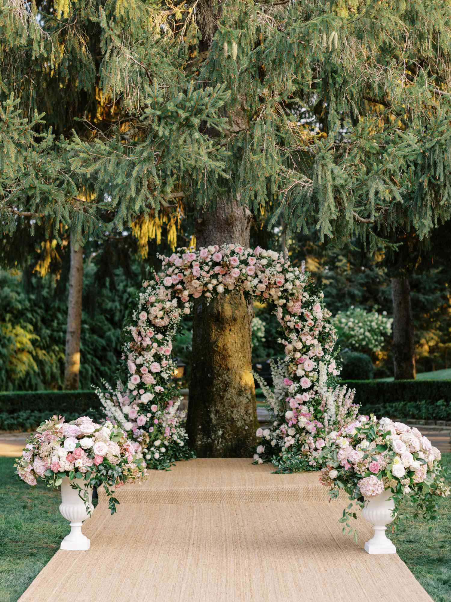 floral arch at outdoor ceremony