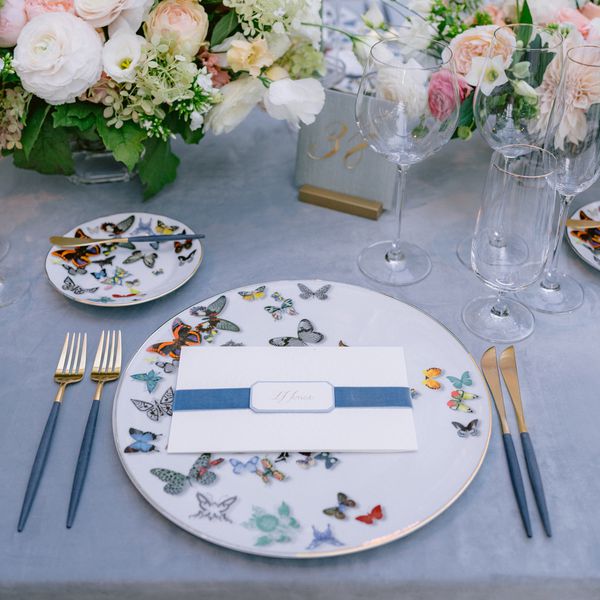 Wedding Reception Plate With Butterfly Pattern and Menu Card With Blue Ribbon on Top