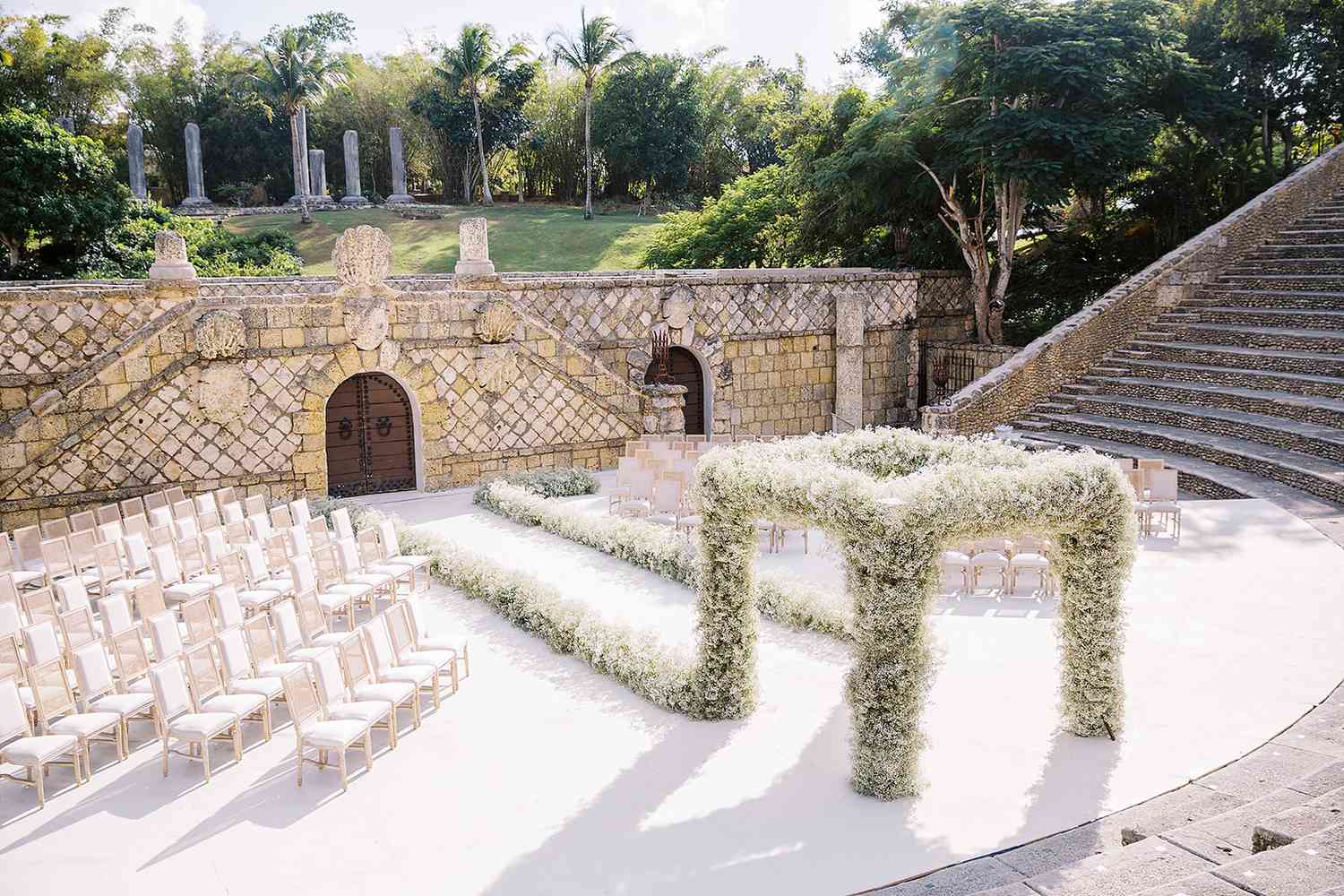 a floral-covered chuppah centered in the Altos de Chavón Amphitheatre in the Dominican Republic