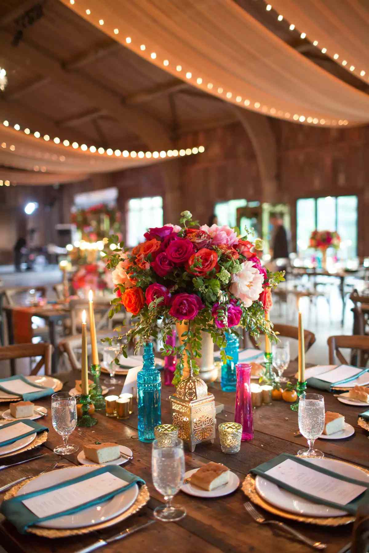 Colorful flowers and lantern amid colorful tablescape