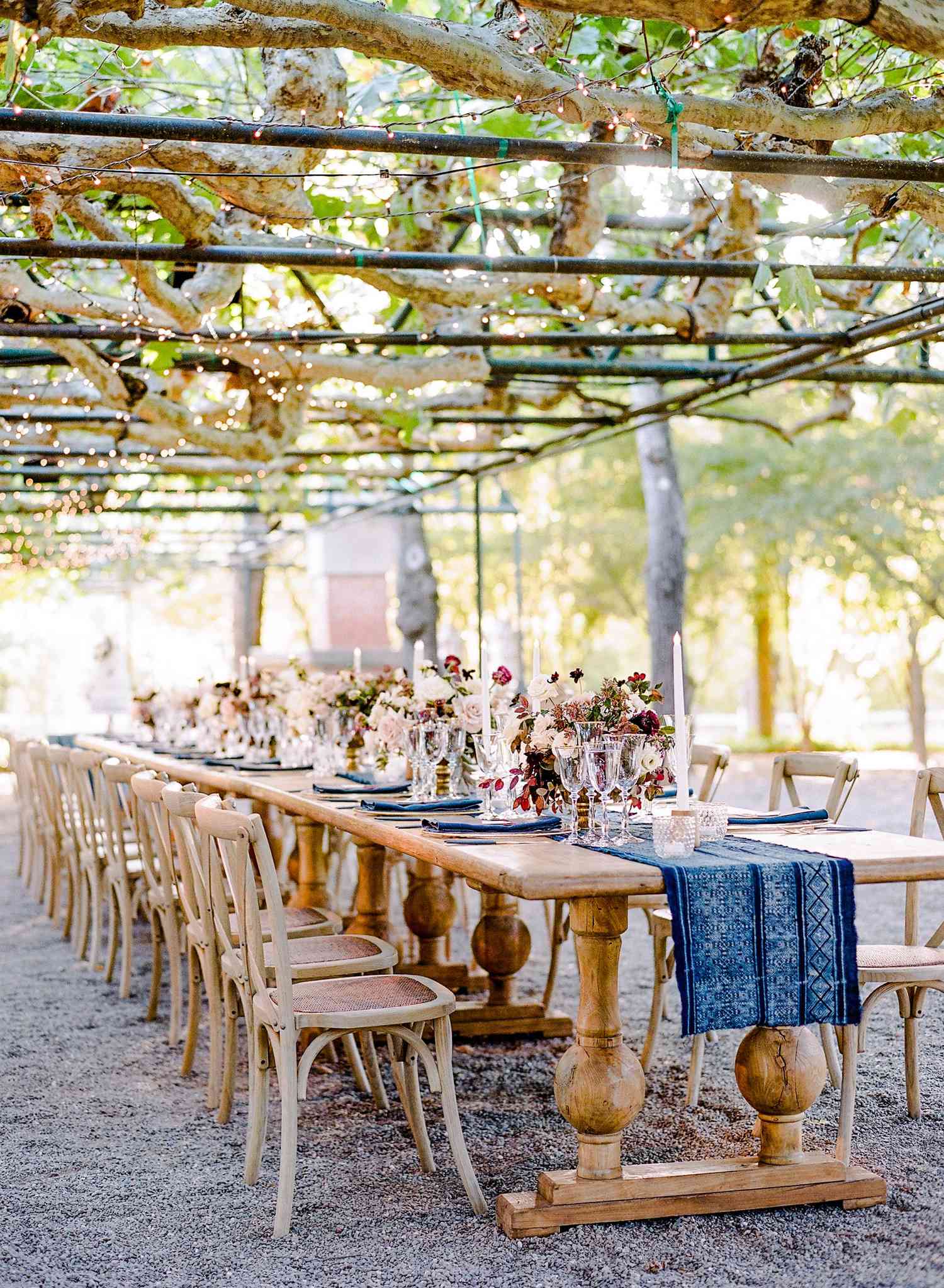 patterned blue table runner with matching napkins and low centerpieces