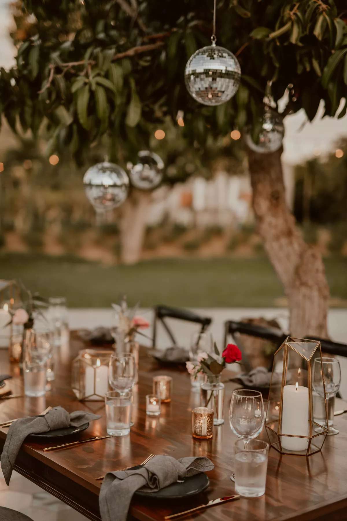 gold geometric lanterns and hanging disco balls