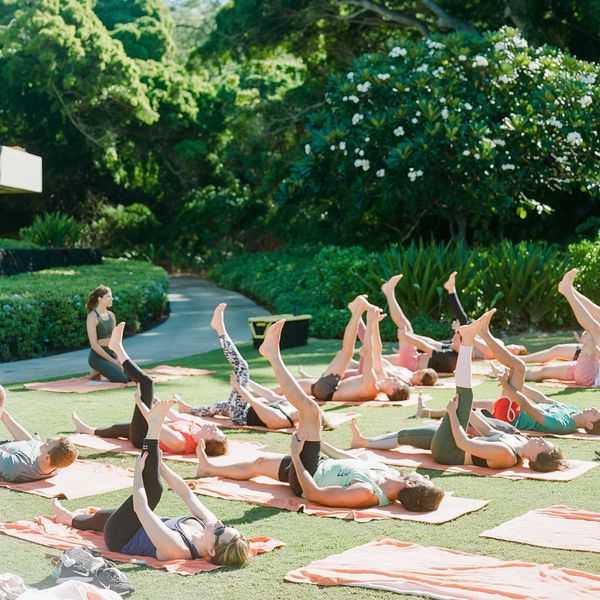 wedding party doing yoga outside