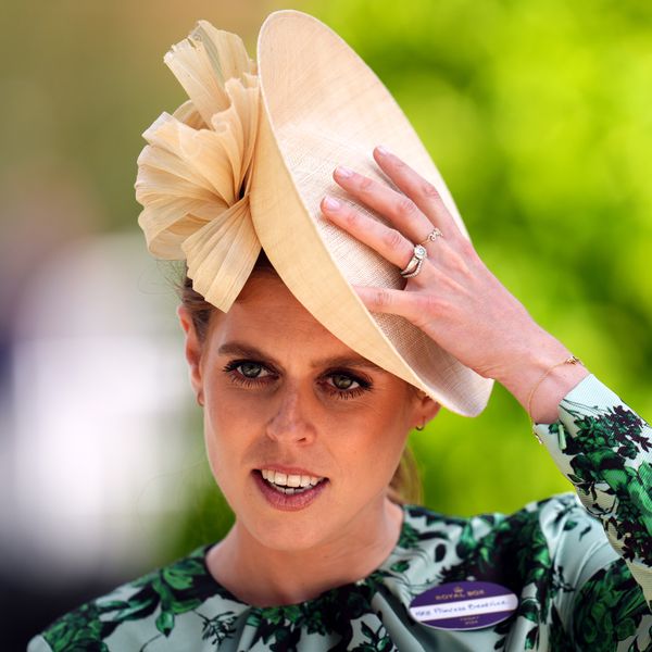 Princess Beatrice Wearing Cream Hat, Green Dress, and Showing Off Art Deco Engagement Ring
