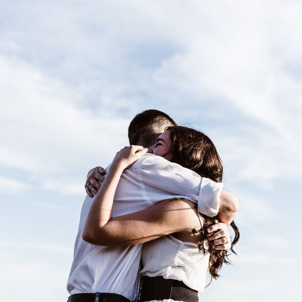 man and woman hugging