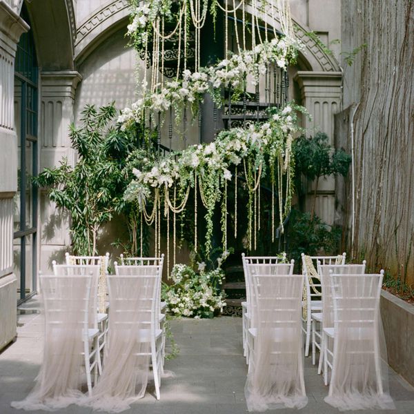 Wedding ceremony with florals on staircase