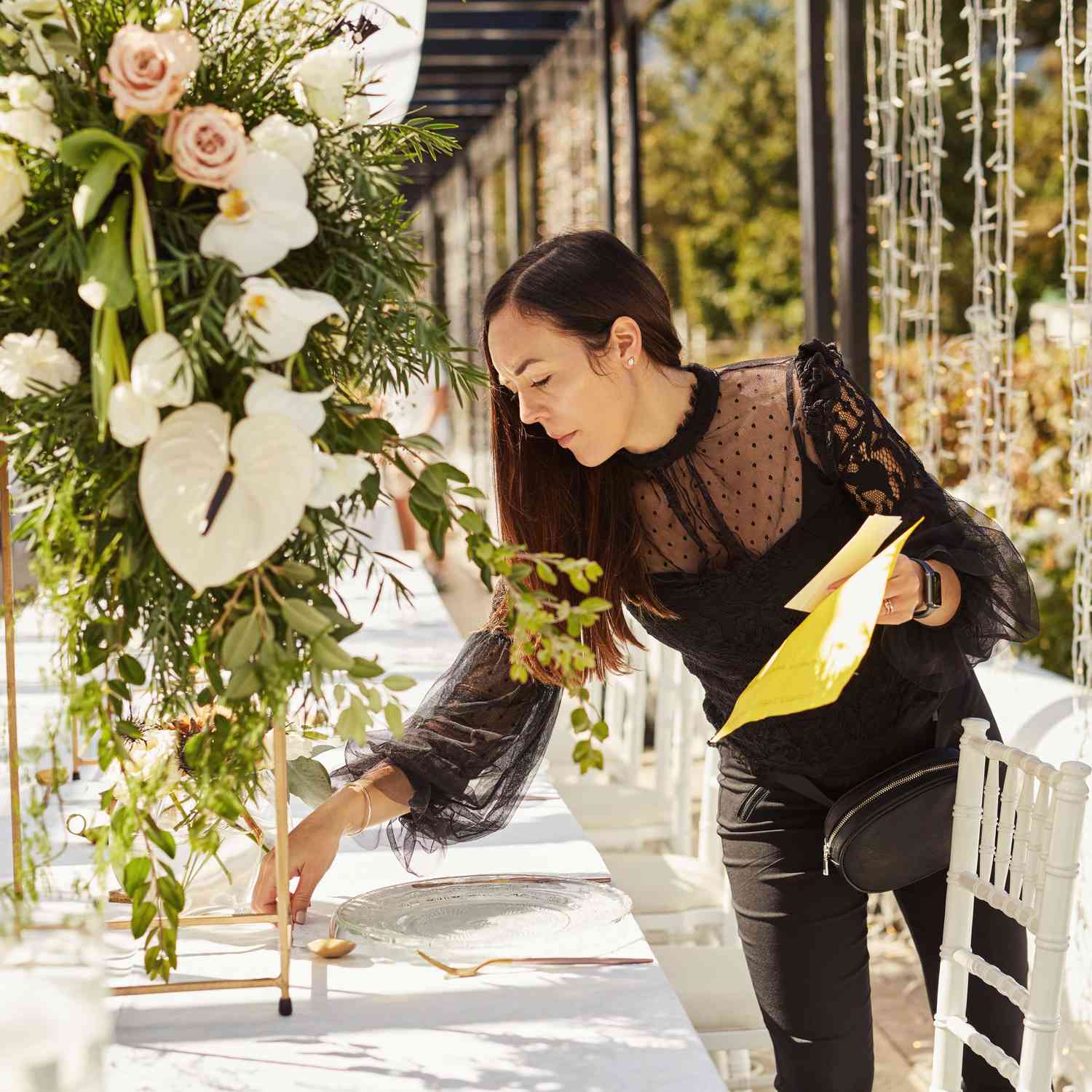 Wedding planner organizing a reception table