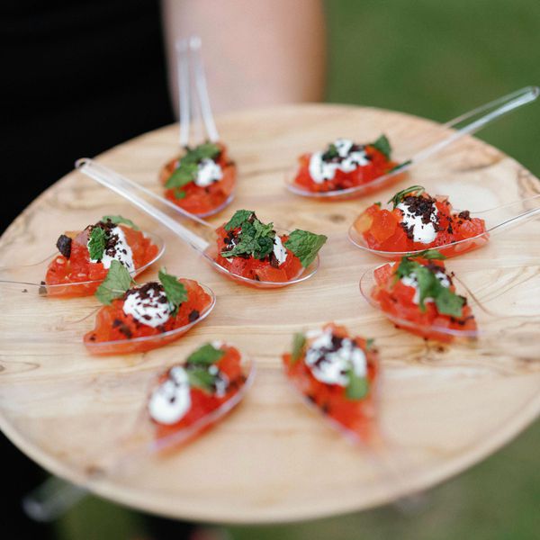 Ahi appetizer on spoons and wood plate for wedding