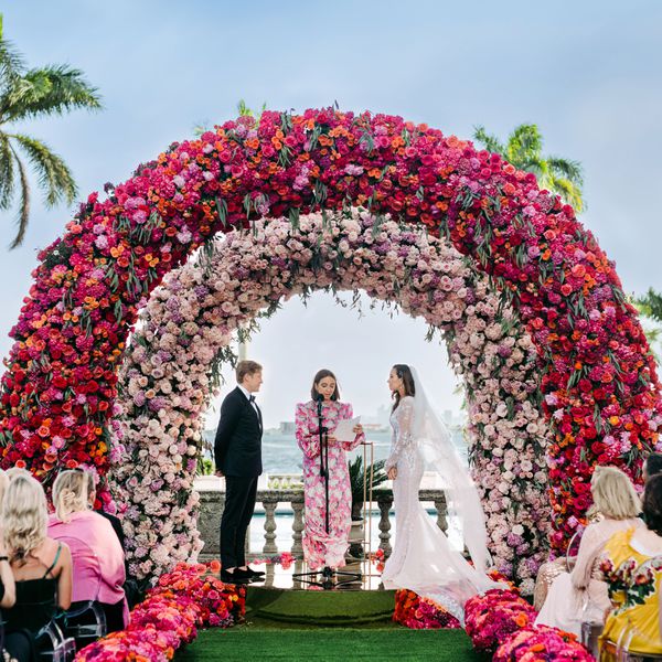 Maya Rudolph officiating in a pink floral dress