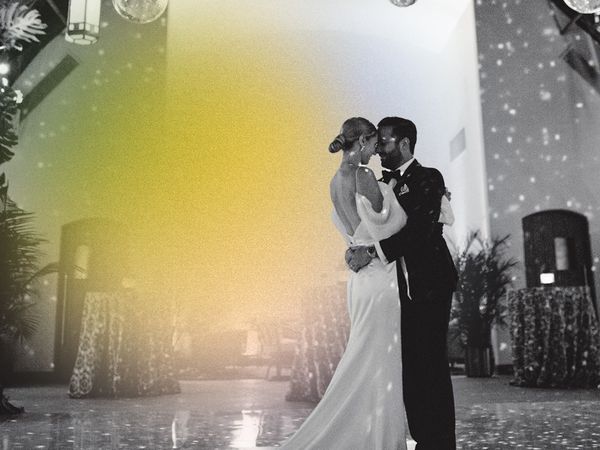 bride and groom do first dance under disco balls