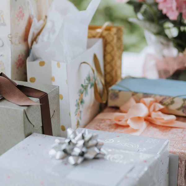 assorted wrapped gifts on table