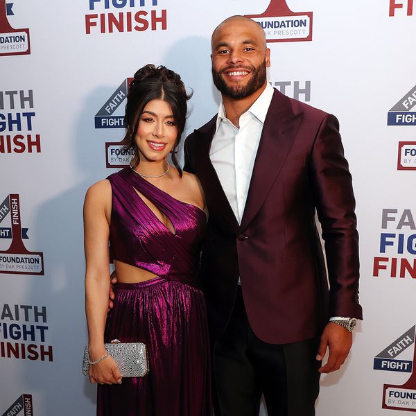 Sarah Jane Ramos in One-Shoulder Sparkly Purple Dress Posing With Dak Prescott in Maroon Suit