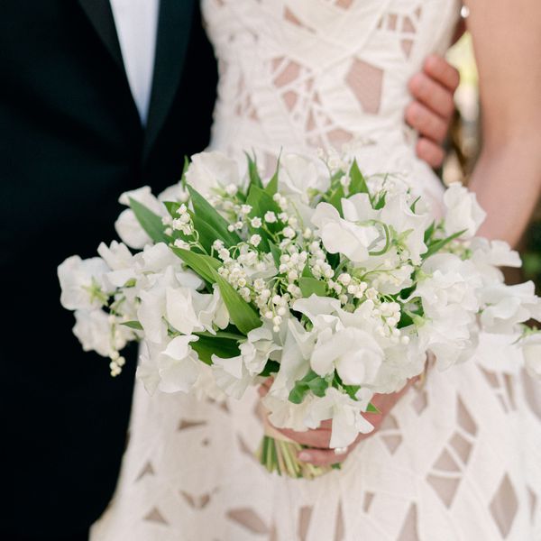 Bouquet of White Lily of the Valley and Sweet Peas With Greenery