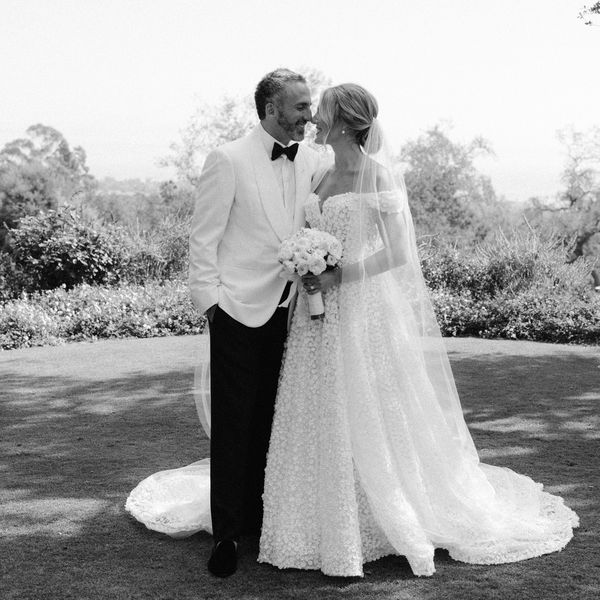 black and white couple portrait of bride and groom facing each other smiling