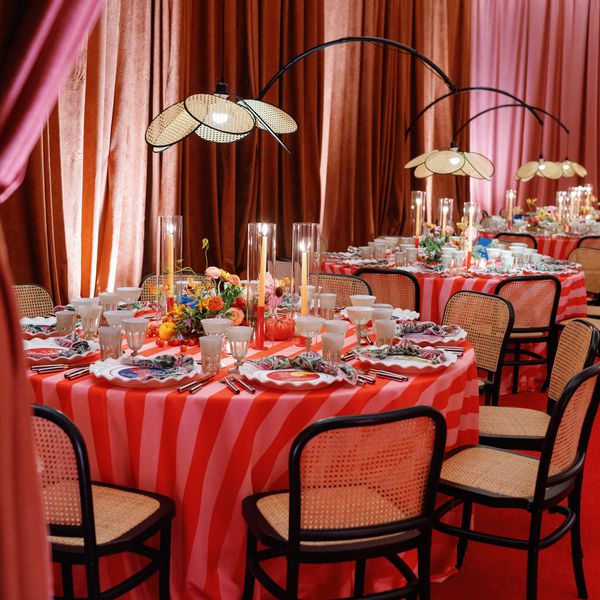 Colorful Round Reception Tables In Room With Pink and Orange Curtains
