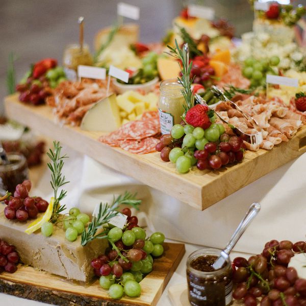 Grazing Table With Grapes, Deli Meats, Cheese, and Mustard