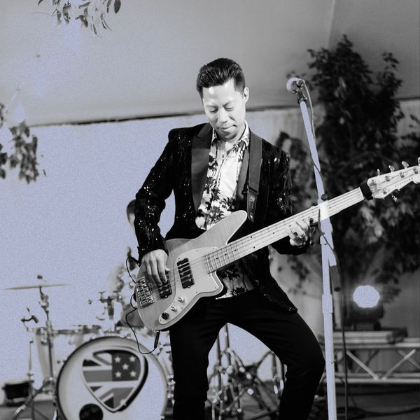 musician playing the bass guitar