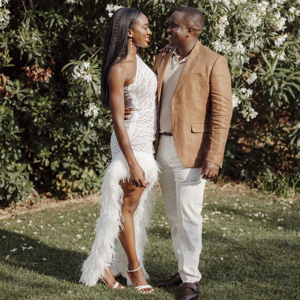 bride and groom gazing into each other's eyes while posing in semi-formal attire