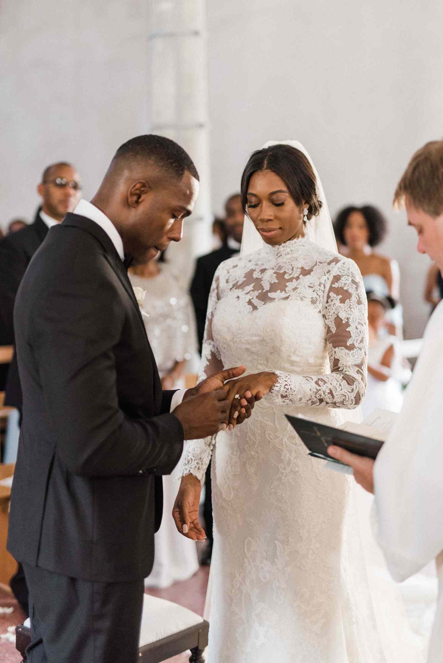 Bride and Groom Exchanging Wedding Rings During Christian Wedding Ceremony