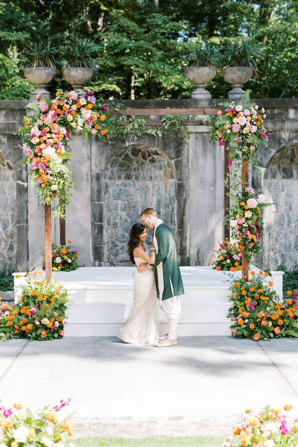 a couple sharing a moment in front of their mandap