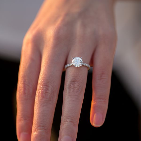 Round-Cut Diamond Engagement Ring on Woman's Hand