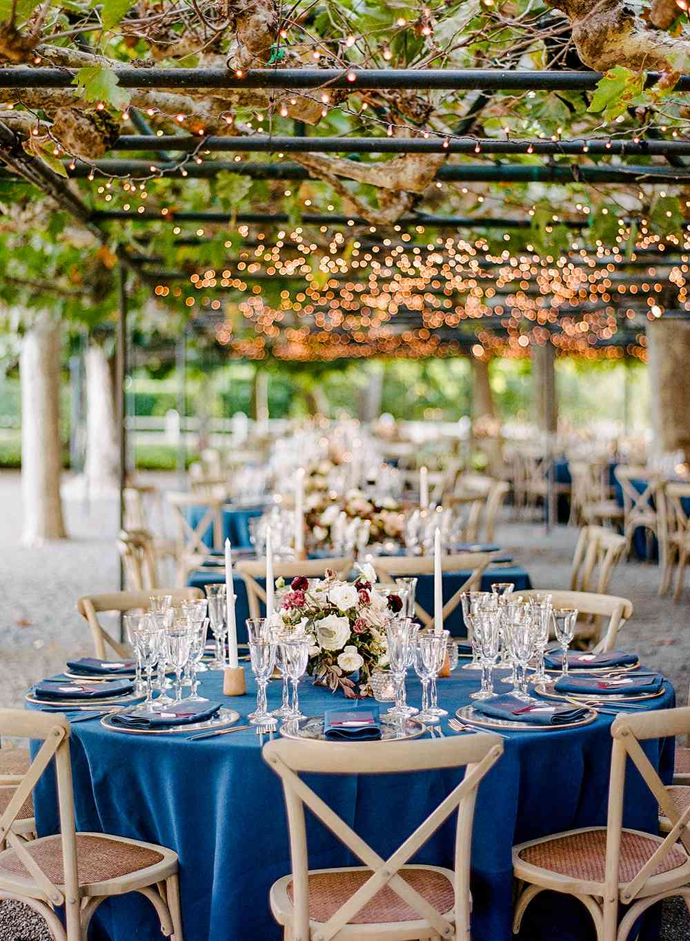 Royal Blue Velvet Tablecloth Draped Over Round Wedding Table