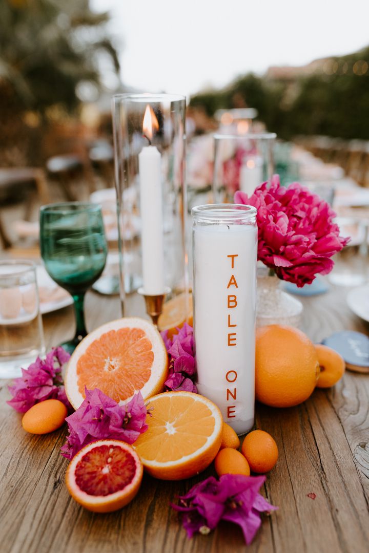Candle Table Numbers With Citrus Accents on Wooden Table
