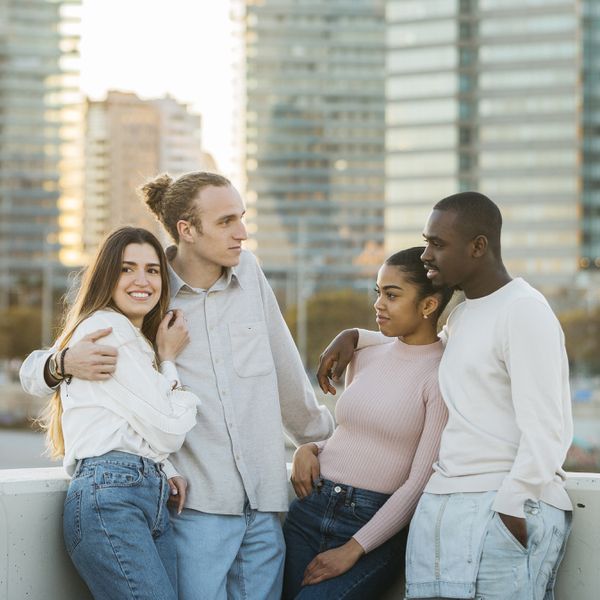 Group of young adult friends hanging out together