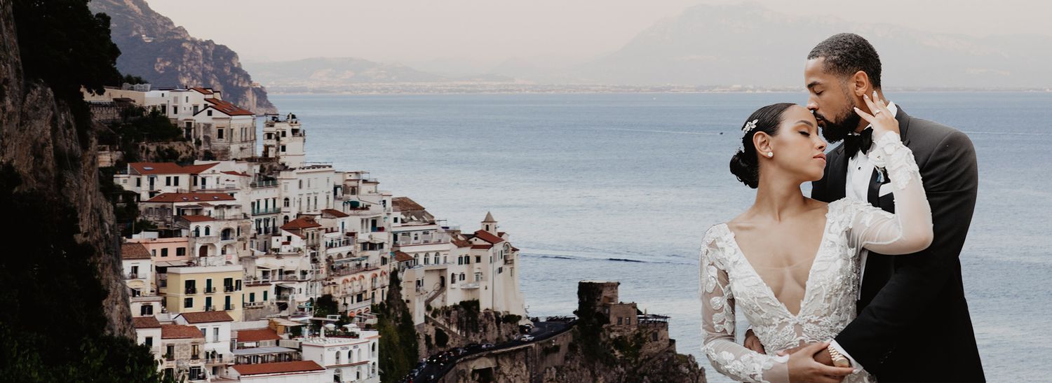 bride and groom portrait in front of a european city backdrop 