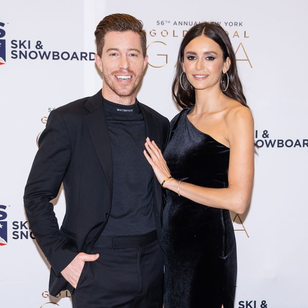 Nina Dobrev in One-Shoulder Black Dress and and Shaun White in Black Suit