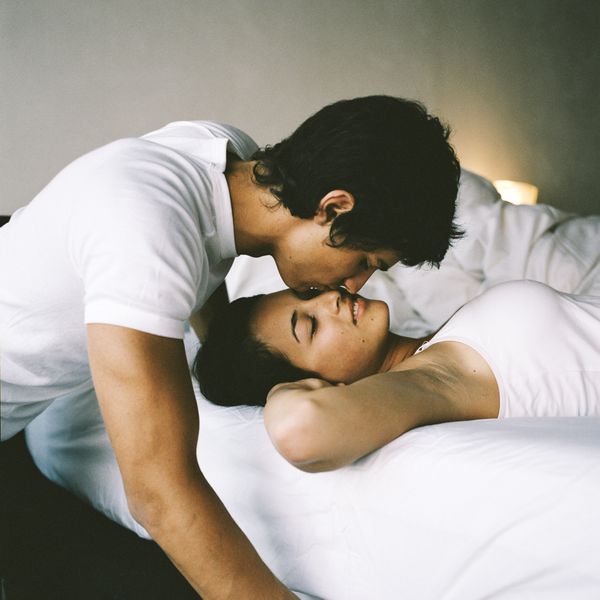 man kissing a woman