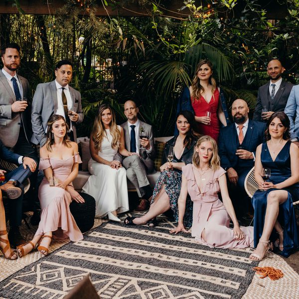photo of bride and groom surrounded by a group of friends