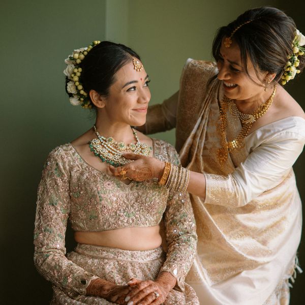 A Bride's Mother Adjusts Her Jewelry on Her Wedding Day, a Something Borrowed Idea