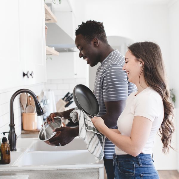 Couple Washing Dishes Together