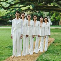 women and man in white