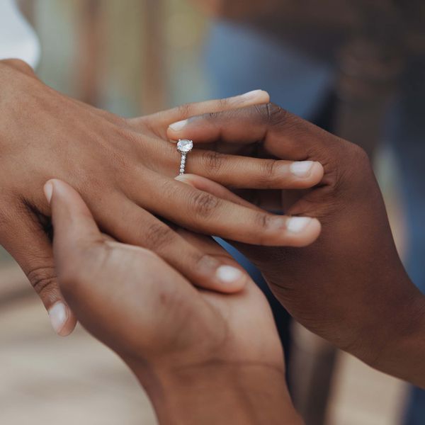 woman showing off diamond engagement ring
