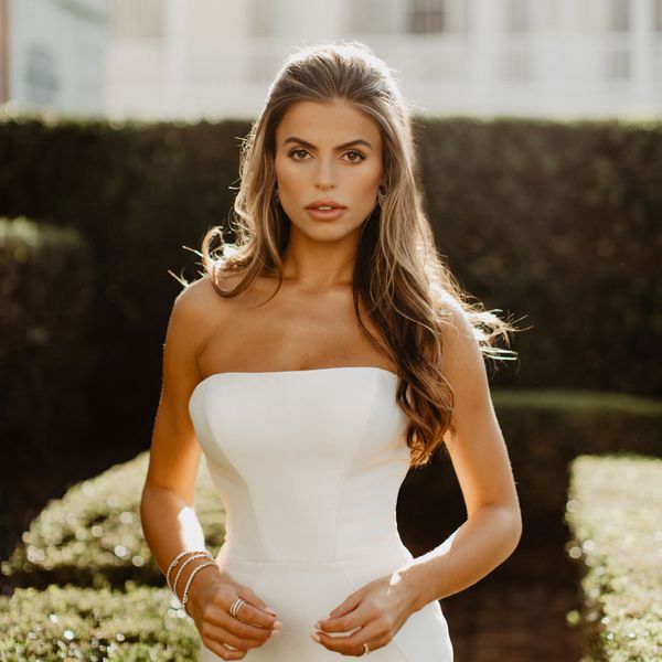 photo of a bride in strapless wedding dress with half-up, half-down hairstyle