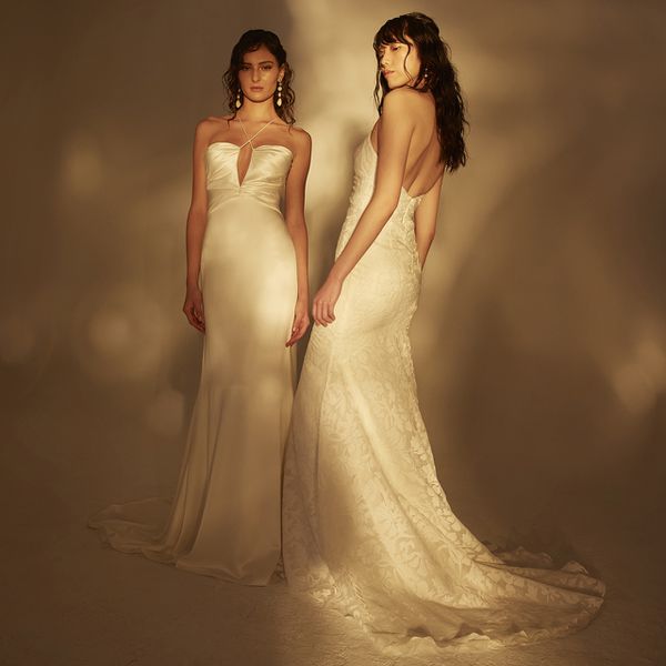 two models wearing form-fitted wedding dresses