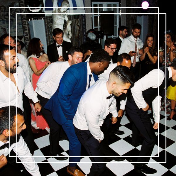 guests on dance floor doing a line dance for weddings