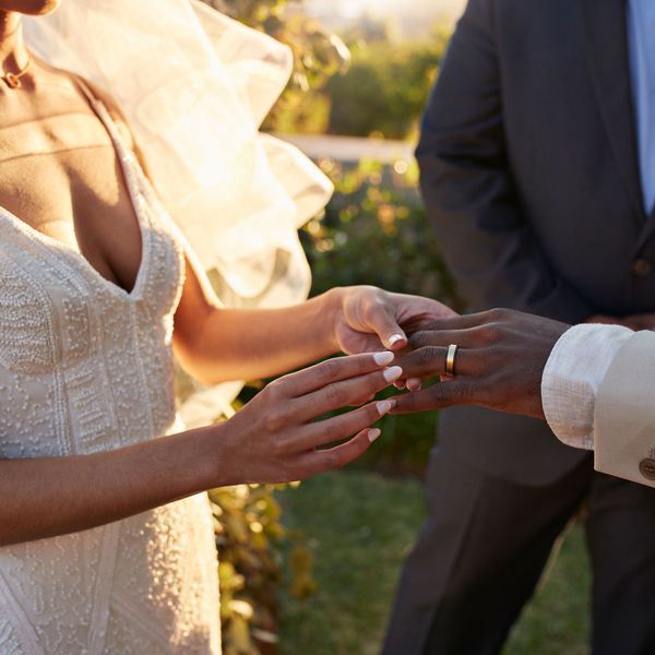 Bride and Groom Exchange Rings, Saying "Till Death Do Us Part" During Vows